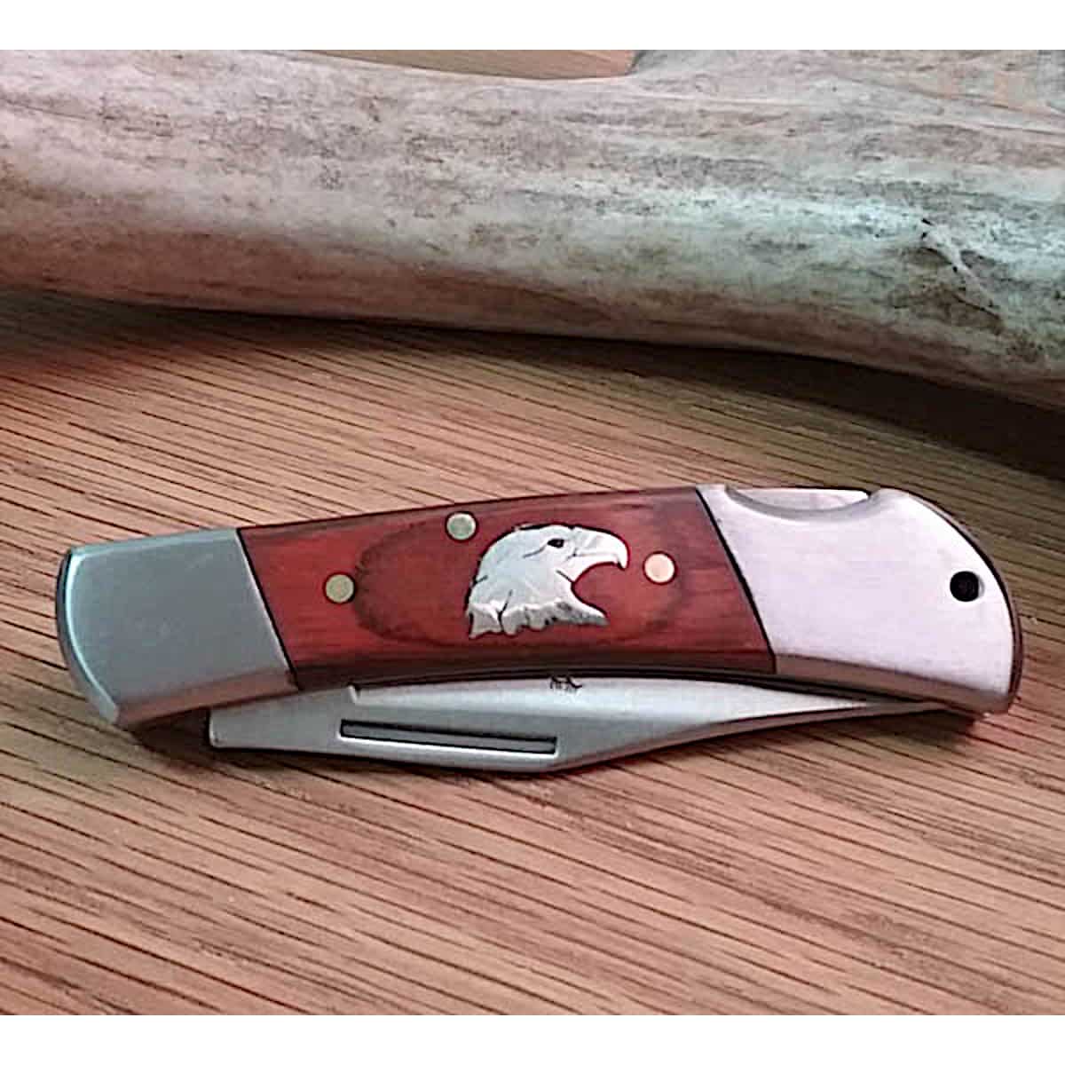 https://www.joewilcoxsedona.com/wp-content/uploads/2021/06/Inlaid-Eagle-Head-Lock-Back-Wood-Knife.jpg