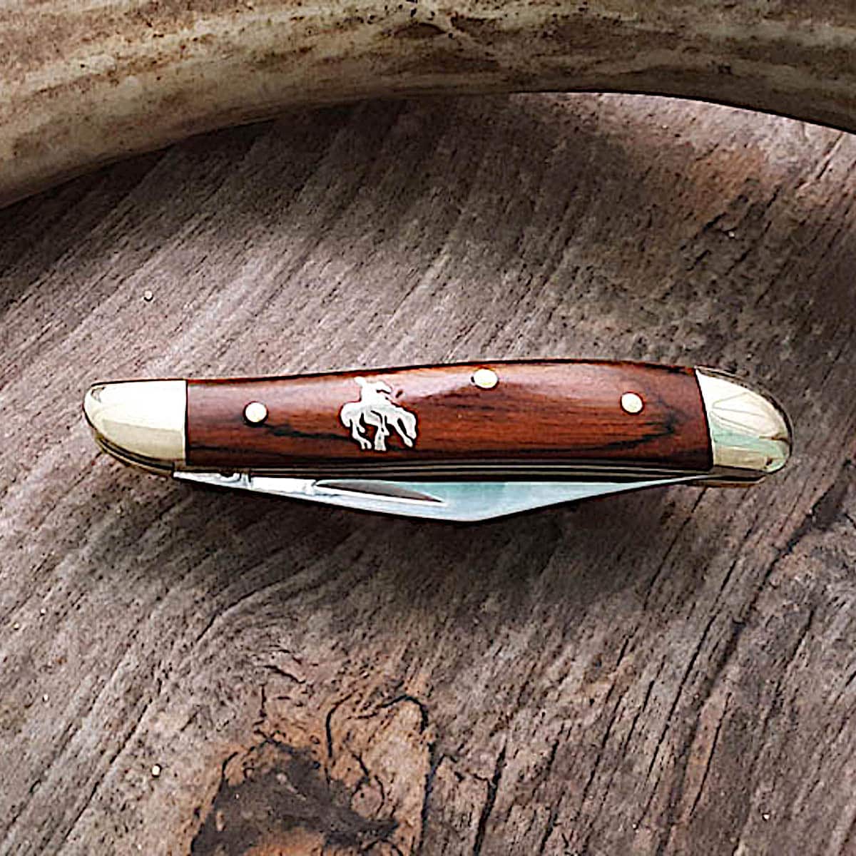 https://www.joewilcoxsedona.com/wp-content/uploads/2021/07/Buffalo-Knives-End-of-Trail-Inlaid-Single-Blade-Peanut-Knife.jpg